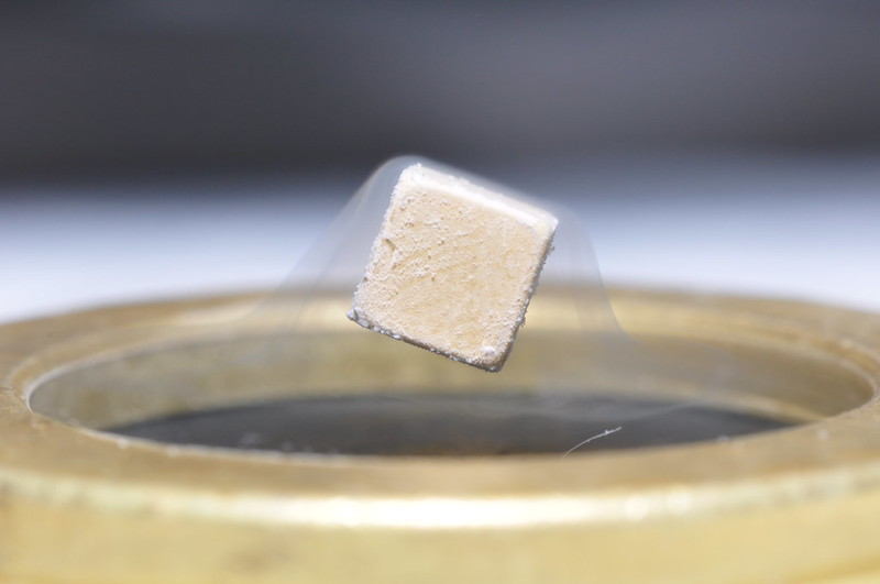 A magnet levitating on a superconductor due to the Meissner effect